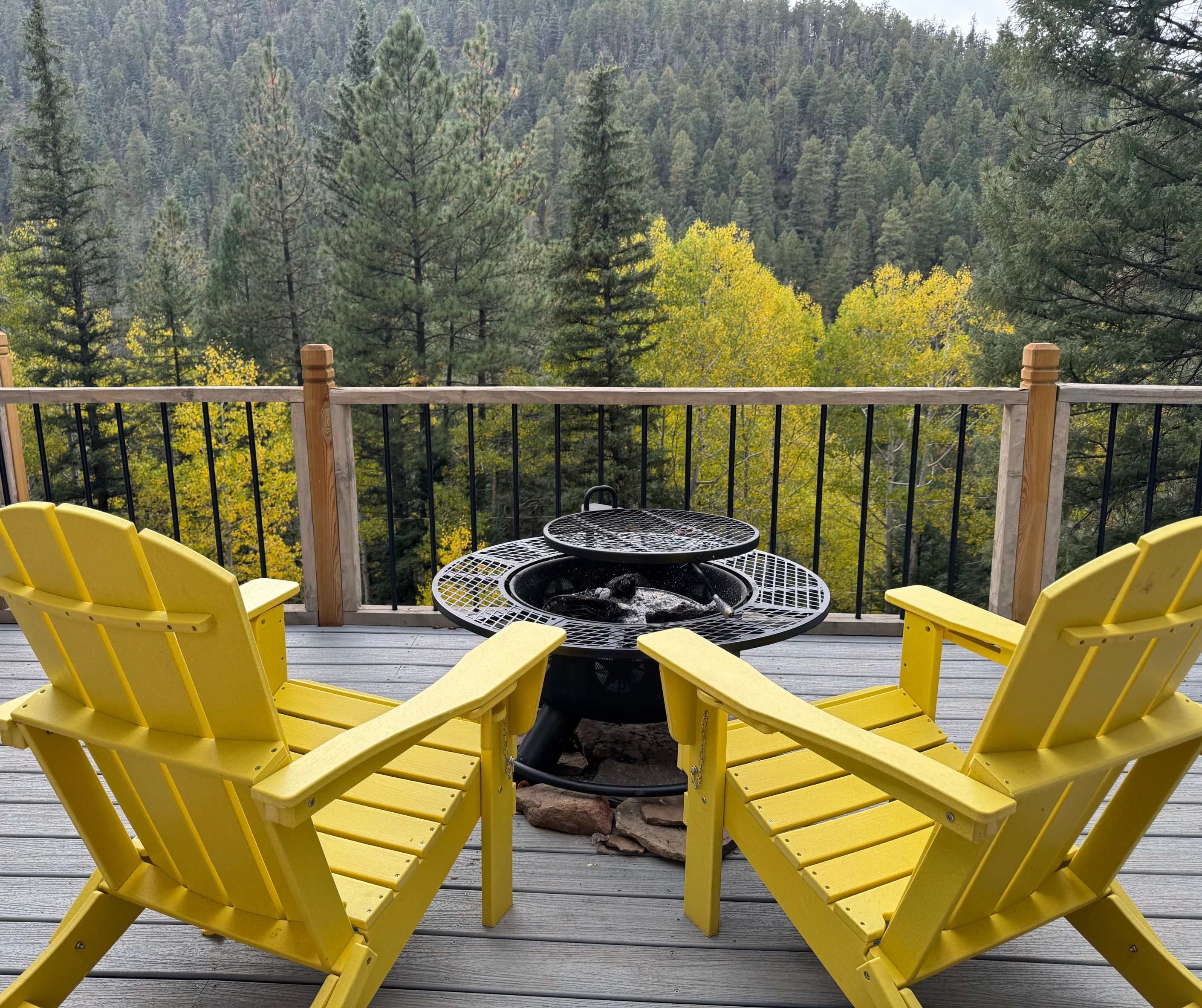 Crestview cabin deck yellow chairs aspen trees Pecos Canyon